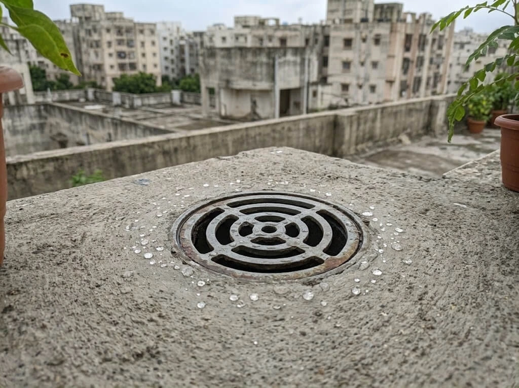 terrace rainwater drain outlet cleared debris monsoon prep India